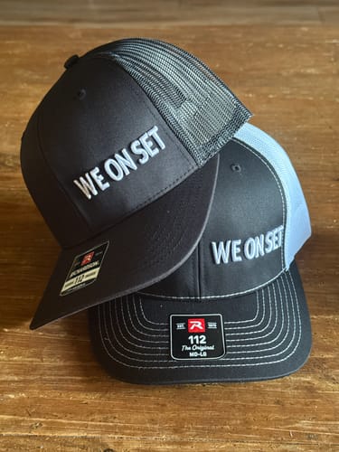 WE ON SET caps on a table