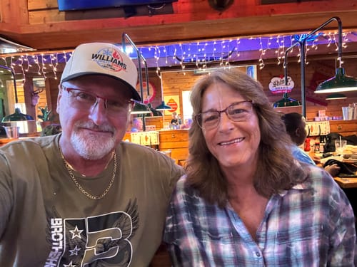 Customers wearing their embroidered caps