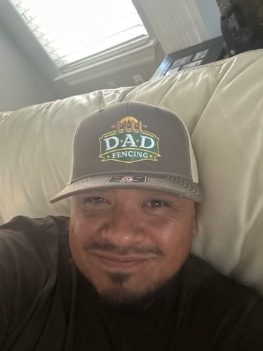 Customer wearing his embroidered trucker cap