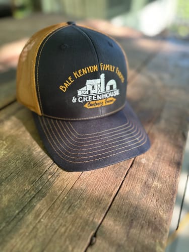 Greenhouse company logo embroidered on a trucker cap