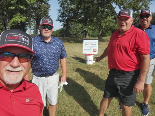 Golfers wearing their embroidered caps at a tournament